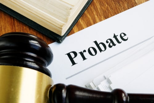 Visual image of a judge's gavel in a probate court with probate filing papers
